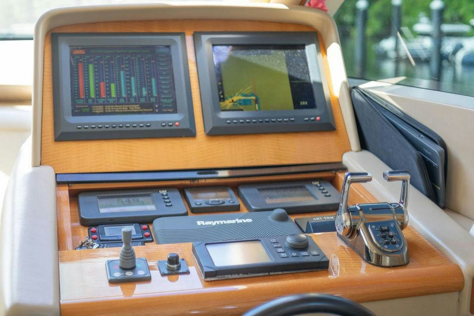 a table with electronics and a monitor aboard CHIP Yacht for Sale