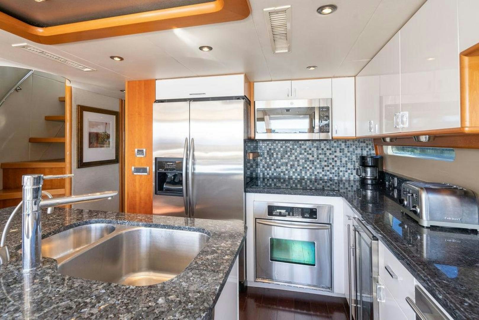 a kitchen with stainless steel appliances aboard CHIP Yacht for Sale