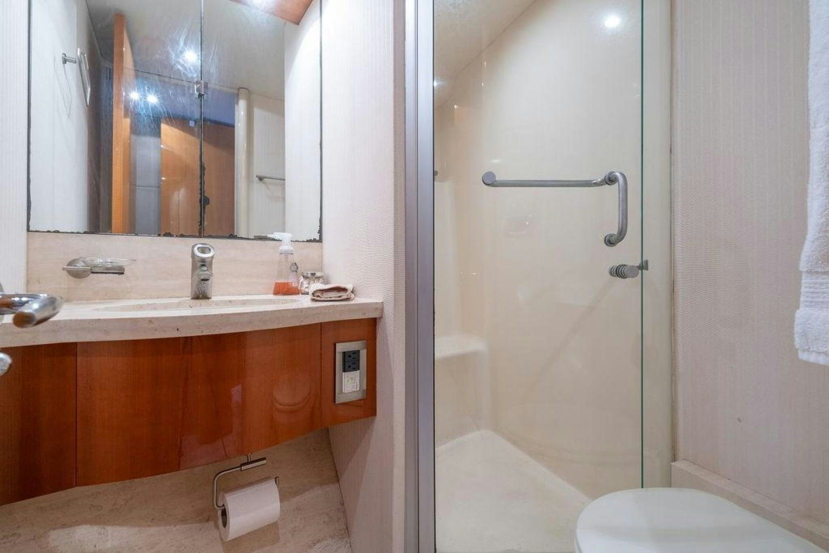 a bathroom with a large mirror aboard CHIP Yacht for Sale