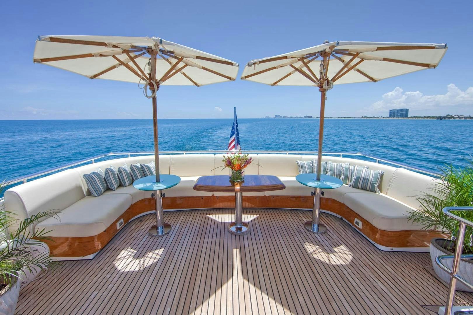 a couple of umbrellas on a beach aboard INCEPTION Yacht for Sale