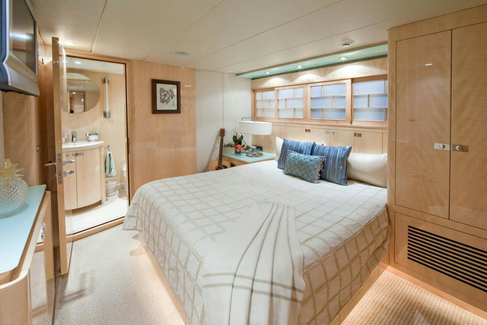 a bedroom with a bed aboard INCEPTION Yacht for Sale