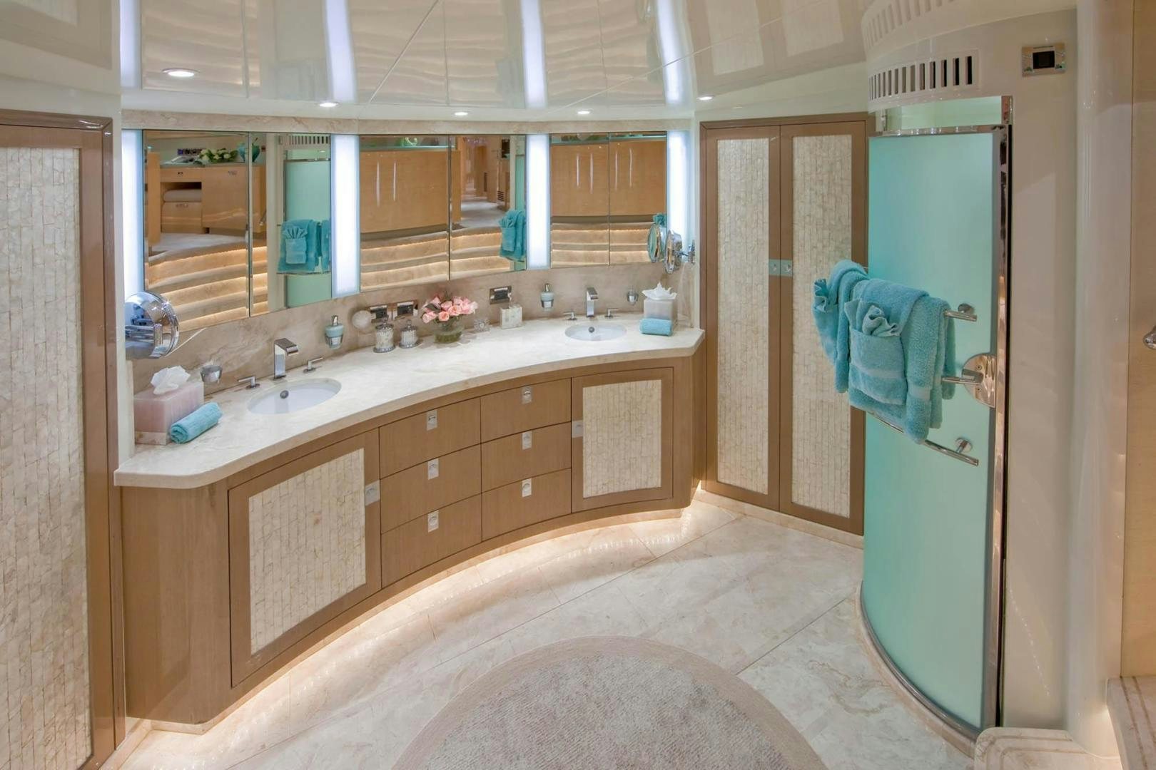 a bathroom with a countertop sink and a mirror aboard INCEPTION Yacht for Sale
