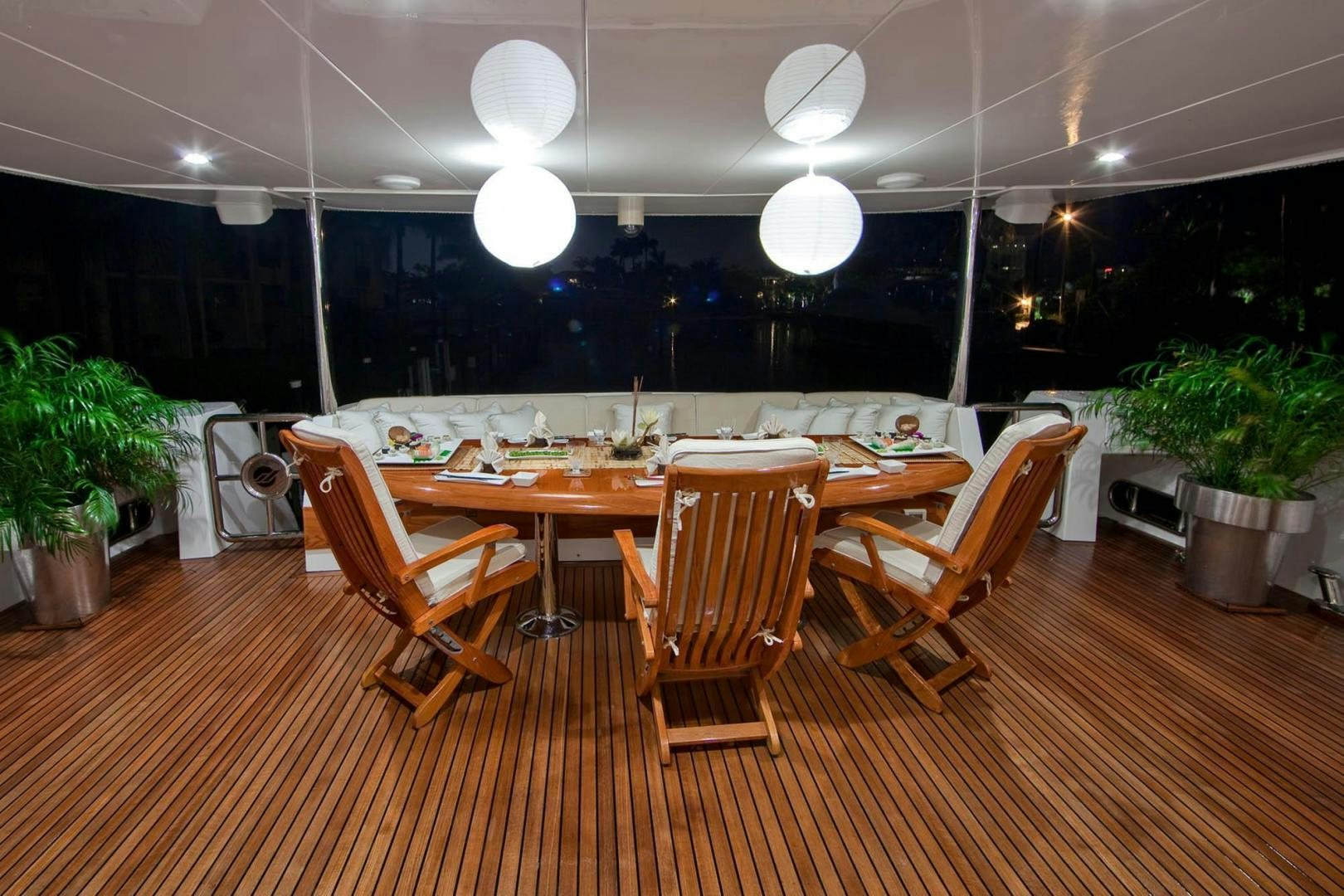 a room with tables and chairs aboard INCEPTION Yacht for Sale