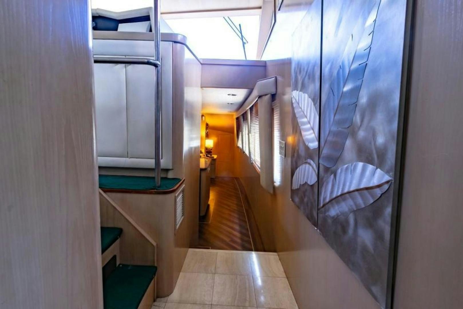 a hallway with a glass door aboard K Yacht for Sale