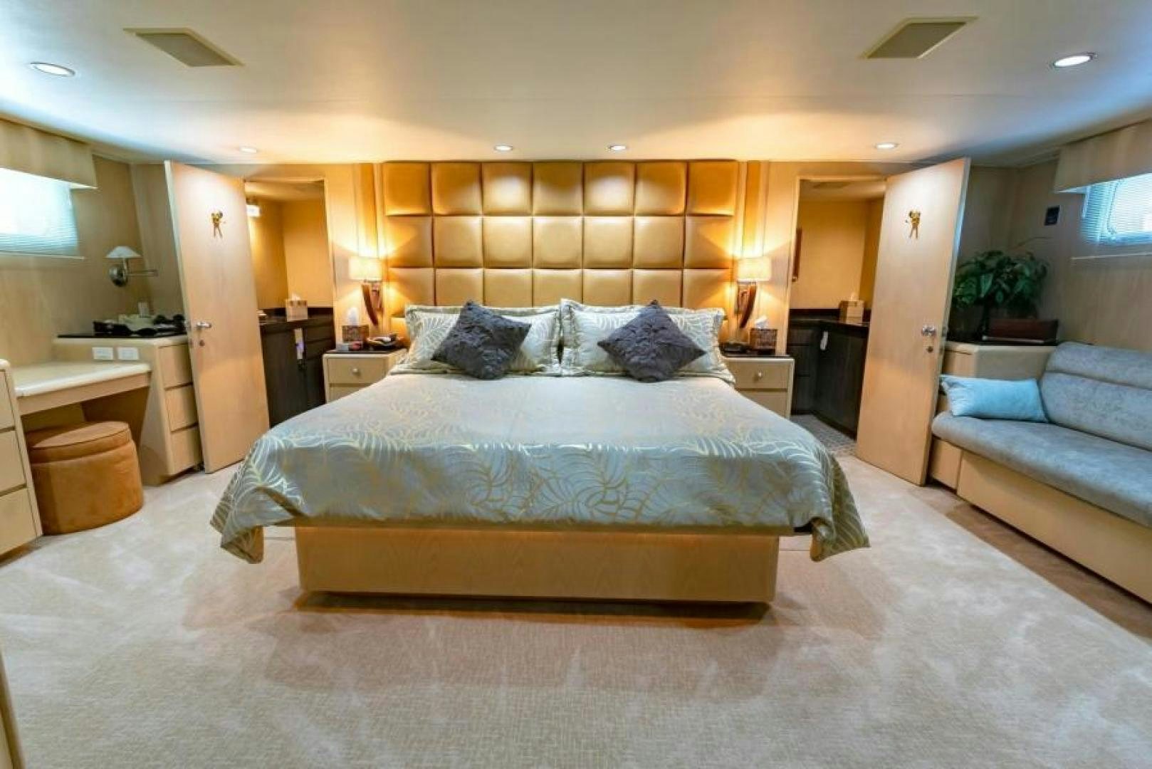 a large bed in a hotel room aboard K Yacht for Sale