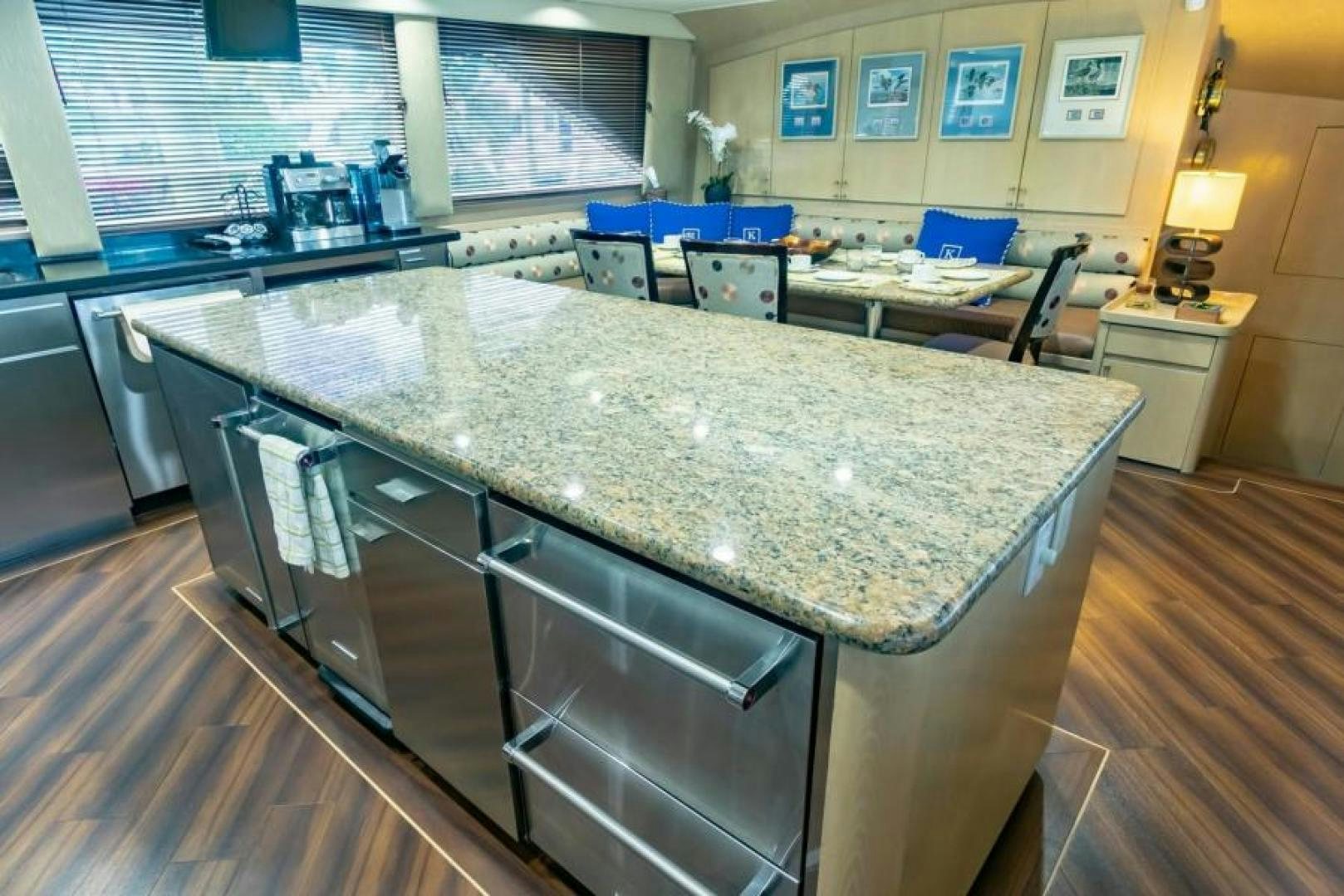 a large kitchen with a large island aboard K Yacht for Sale
