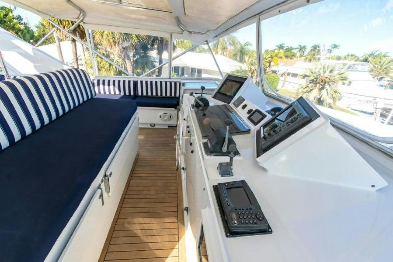 a deck with a deck and a deck with a deck and a pool aboard K Yacht for Sale