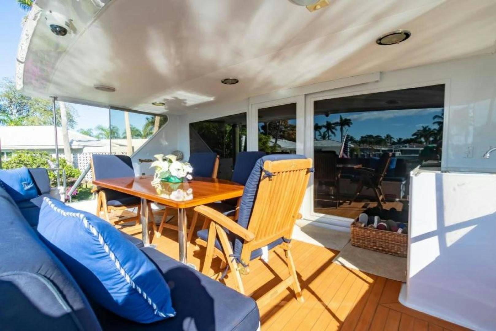 a living room with a table and chairs aboard K Yacht for Sale