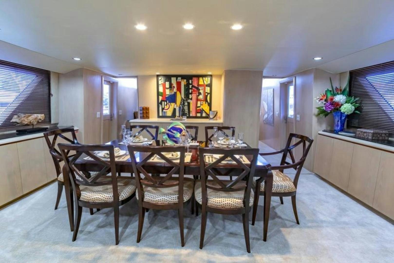 a dining room with a table and chairs aboard K Yacht for Sale