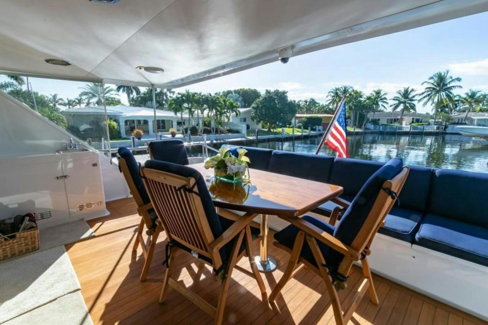 a table and chairs on a deck aboard K Yacht for Sale