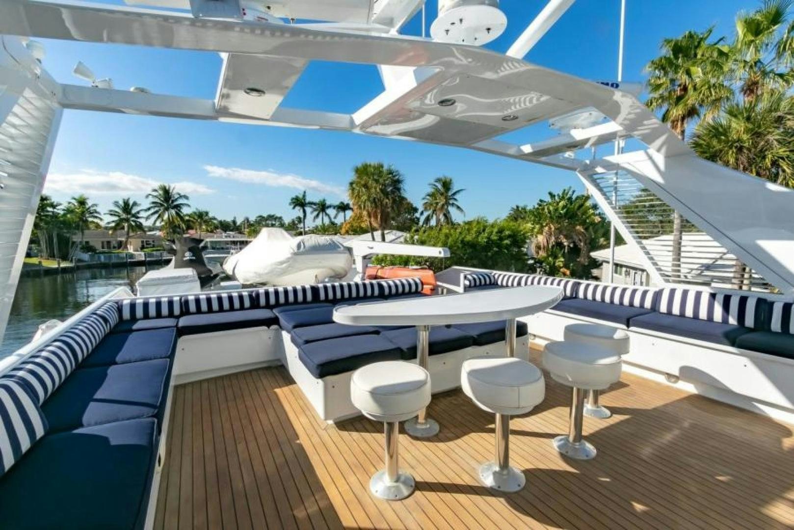 a deck with a pool and lounge chairs aboard K Yacht for Sale