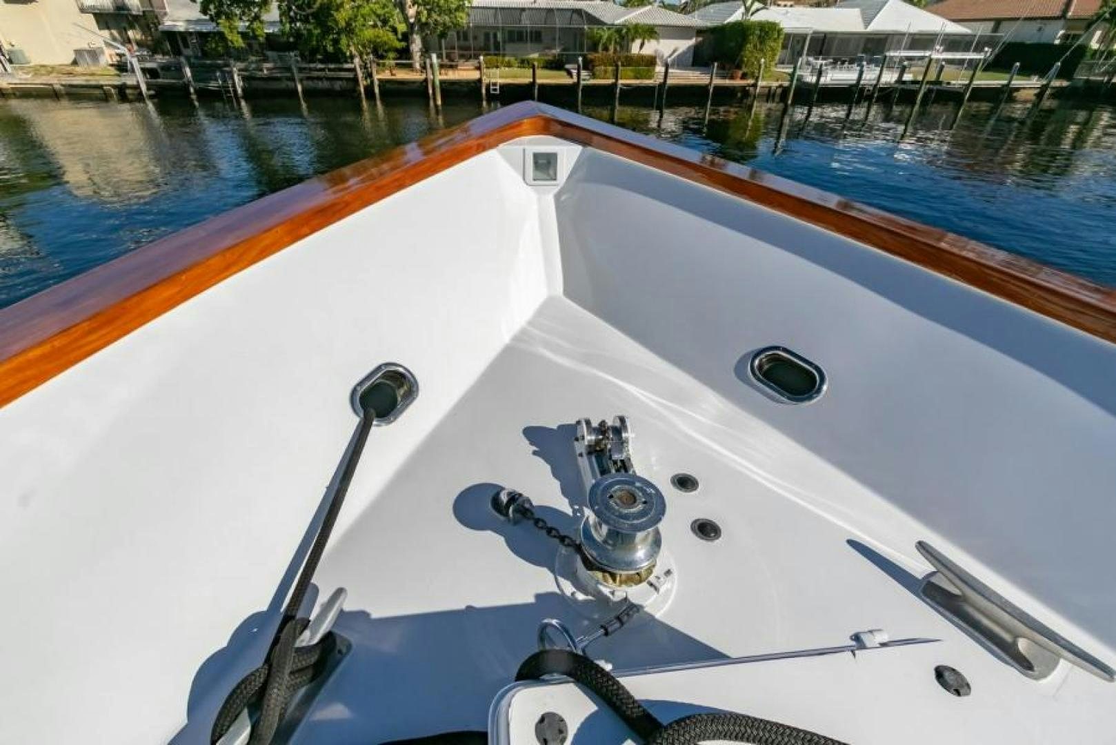 a white boat with a blue water and a metal pipe aboard K Yacht for Sale