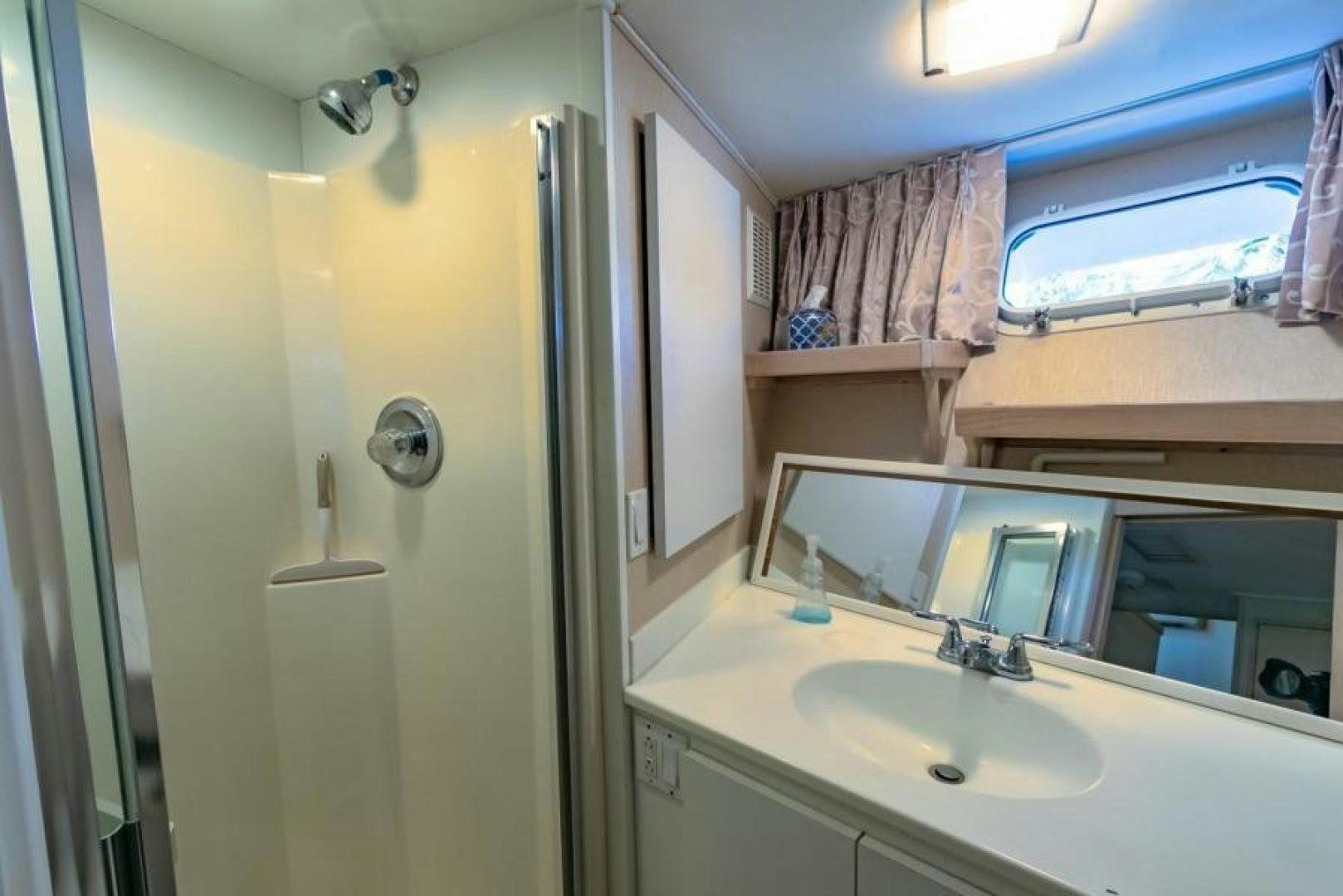 a bathroom with a sink and a mirror aboard K Yacht for Sale