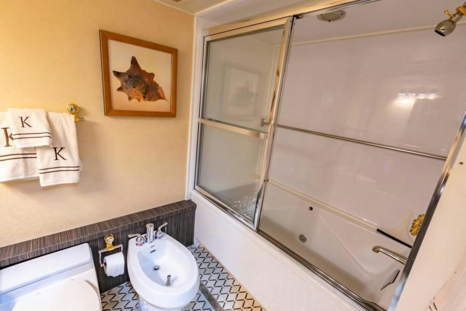 a bathroom with a large mirror aboard K Yacht for Sale