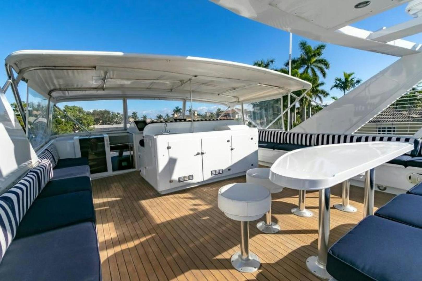 a boat with a deck and chairs aboard K Yacht for Sale
