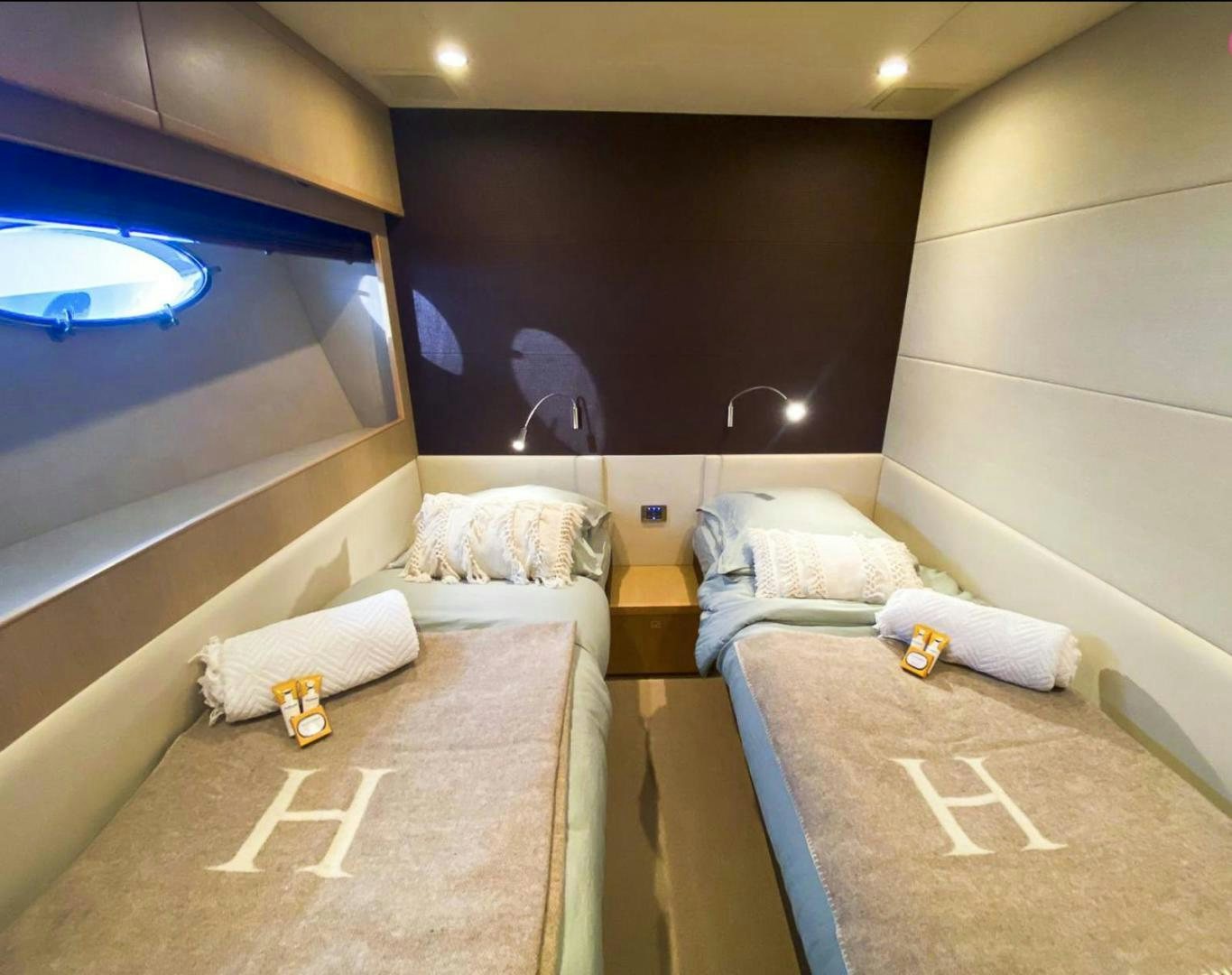 a room with a bed and a window aboard GITANA I Yacht for Sale