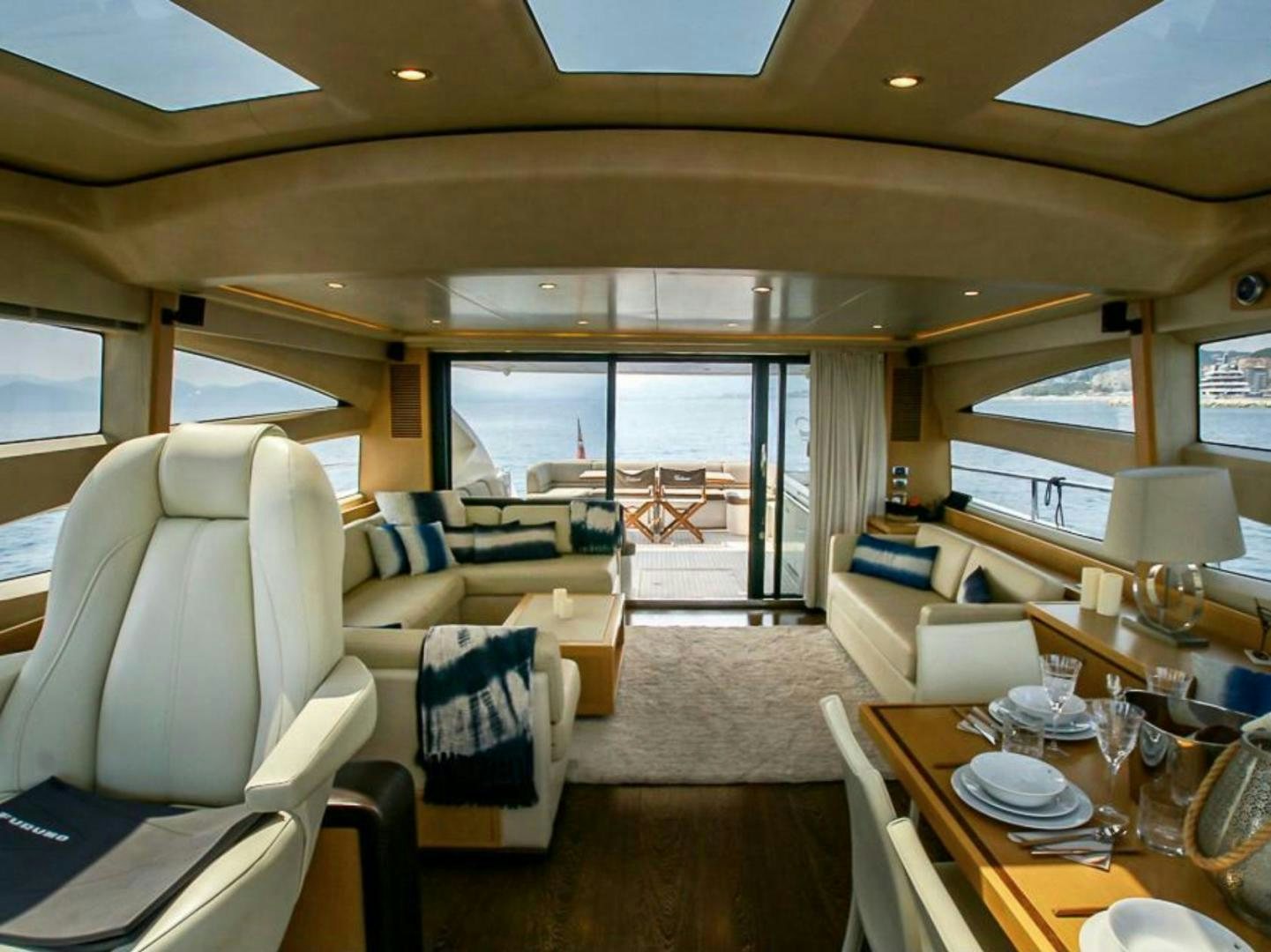 a living room with a large window aboard GITANA I Yacht for Sale