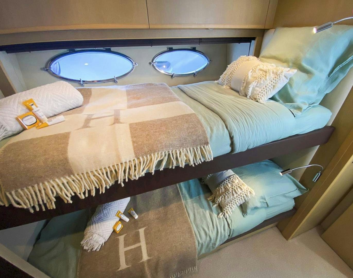 a bed with a tray on it aboard GITANA I Yacht for Sale