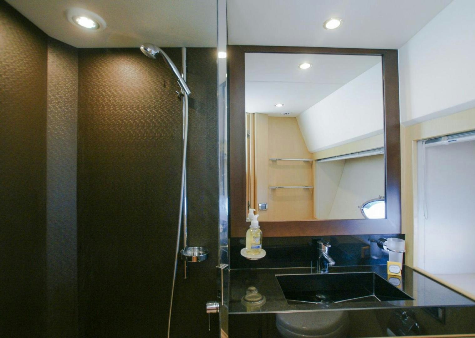 a kitchen with a glass shower aboard GITANA I Yacht for Sale