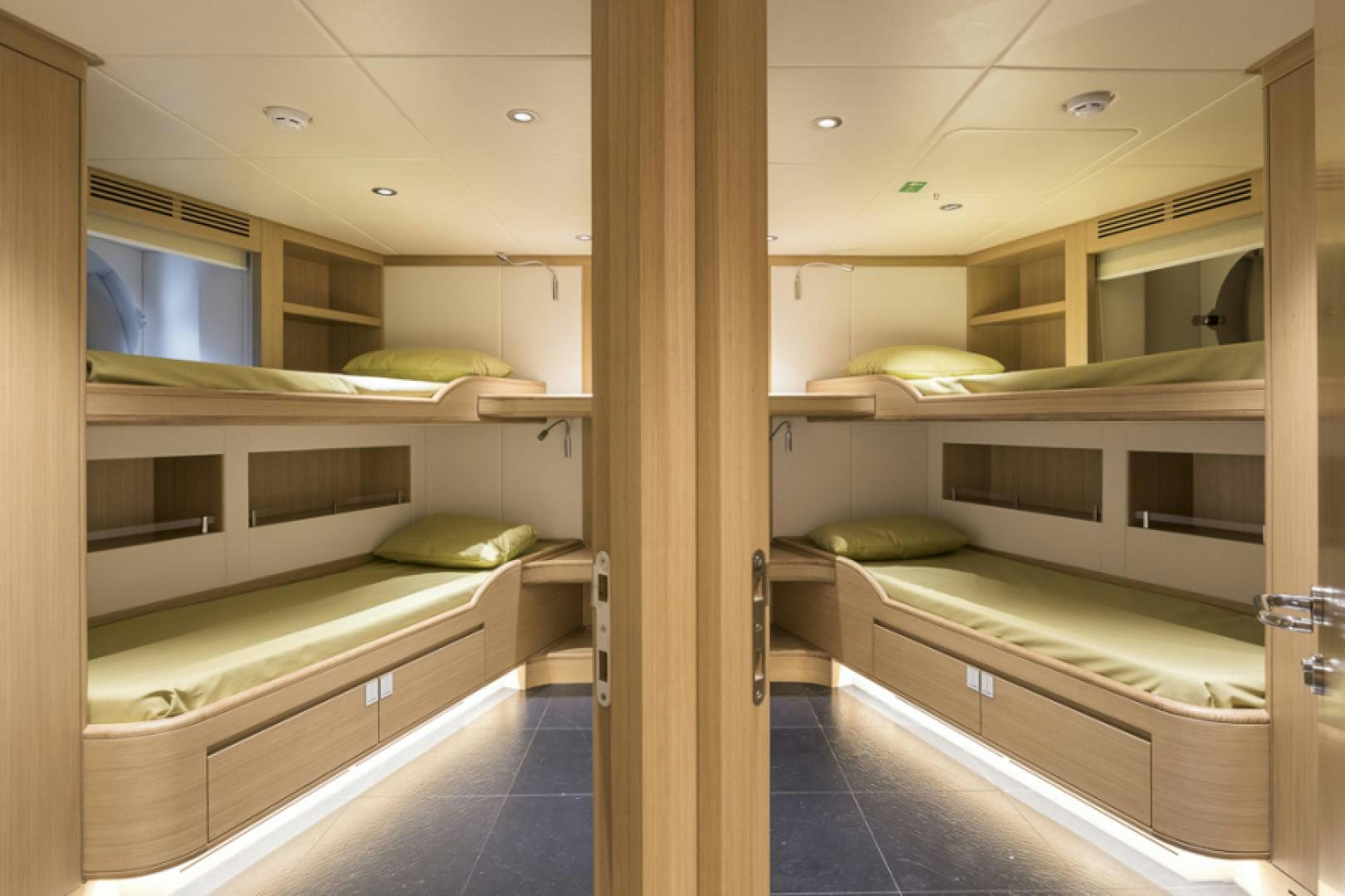 a room with bunk beds aboard KRISHH Yacht for Sale