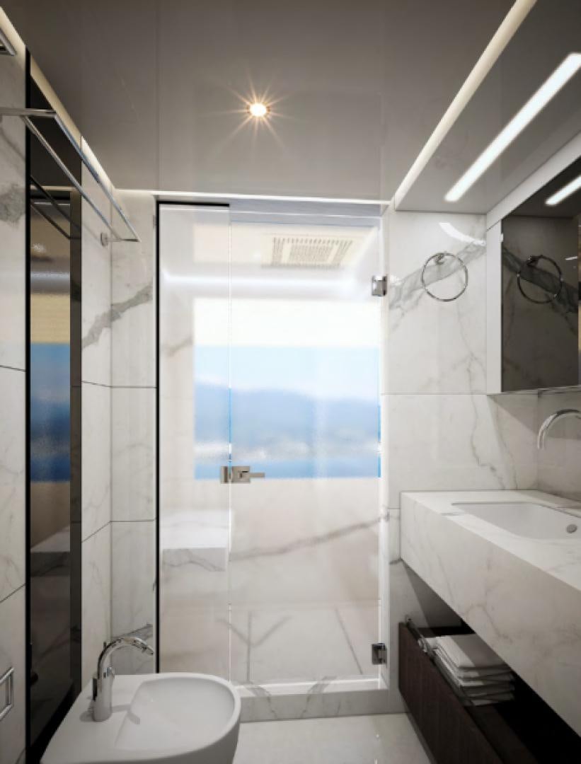 a bathroom with a glass shower aboard KRISHH Yacht for Sale