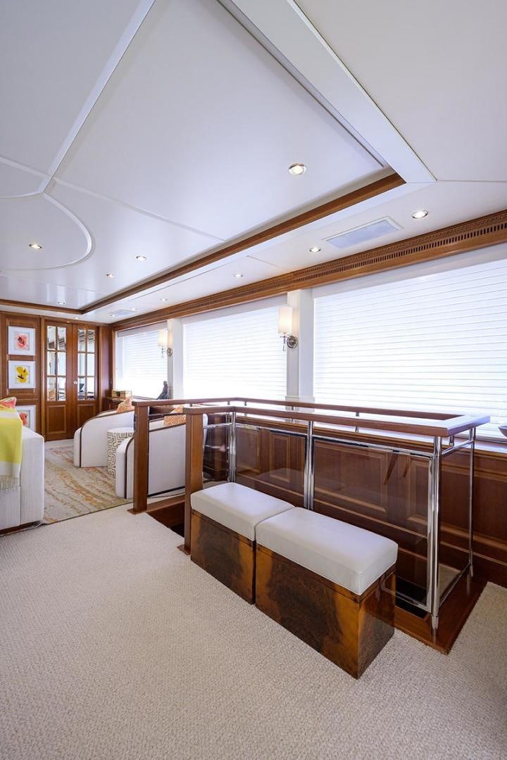 a large room with a bed and a large window aboard BW Yacht for Sale