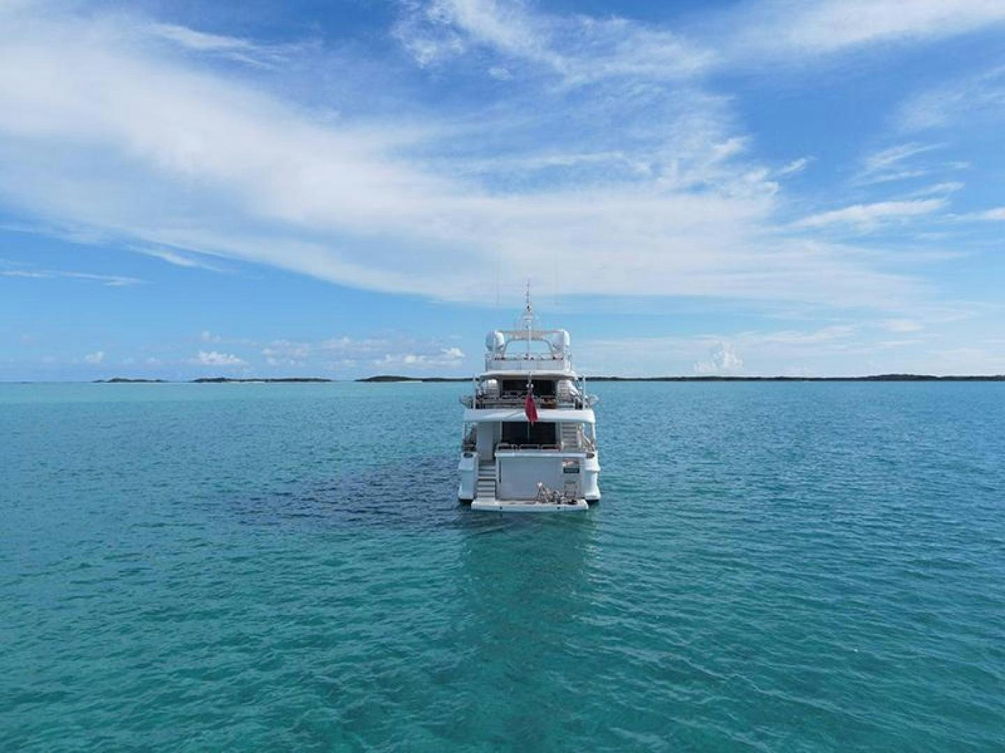 a small white boat in the water aboard BW Yacht for Sale
