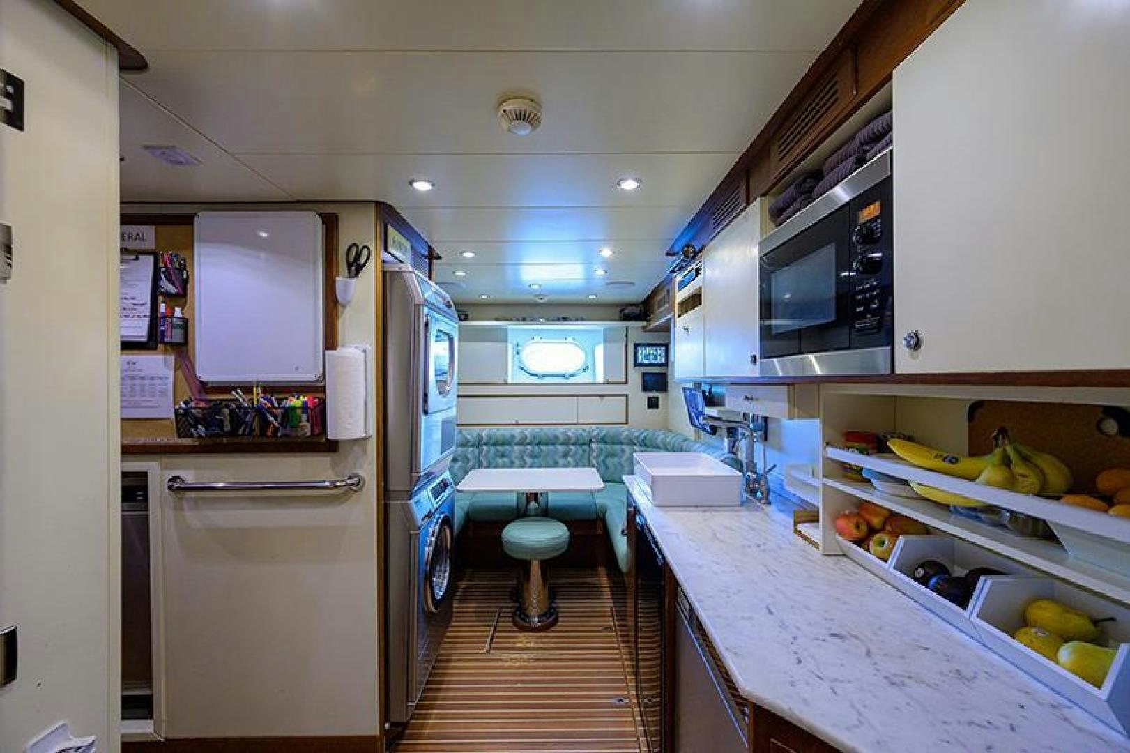 a kitchen with a table and chairs aboard BW Yacht for Sale