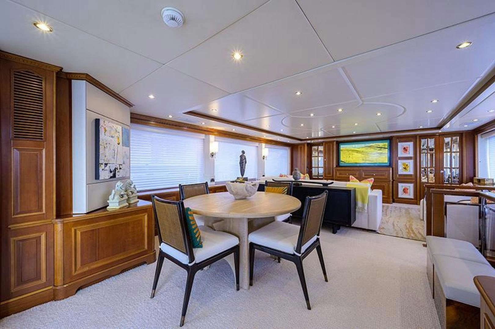 a room with a table and chairs aboard BW Yacht for Sale
