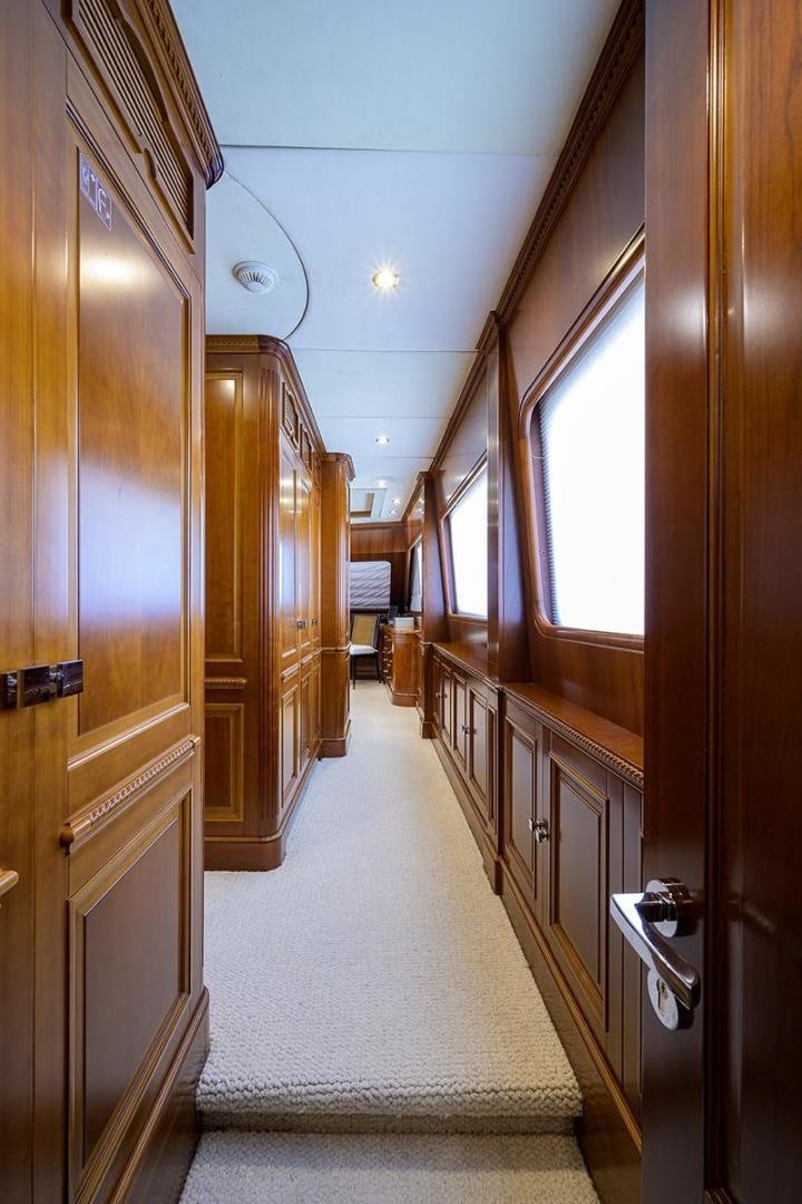 a hallway with wood doors aboard BW Yacht for Sale