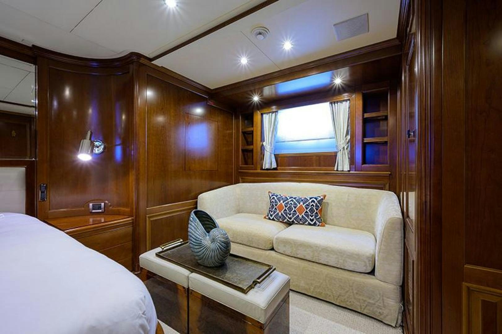 a living room with a couch and a table aboard BW Yacht for Sale