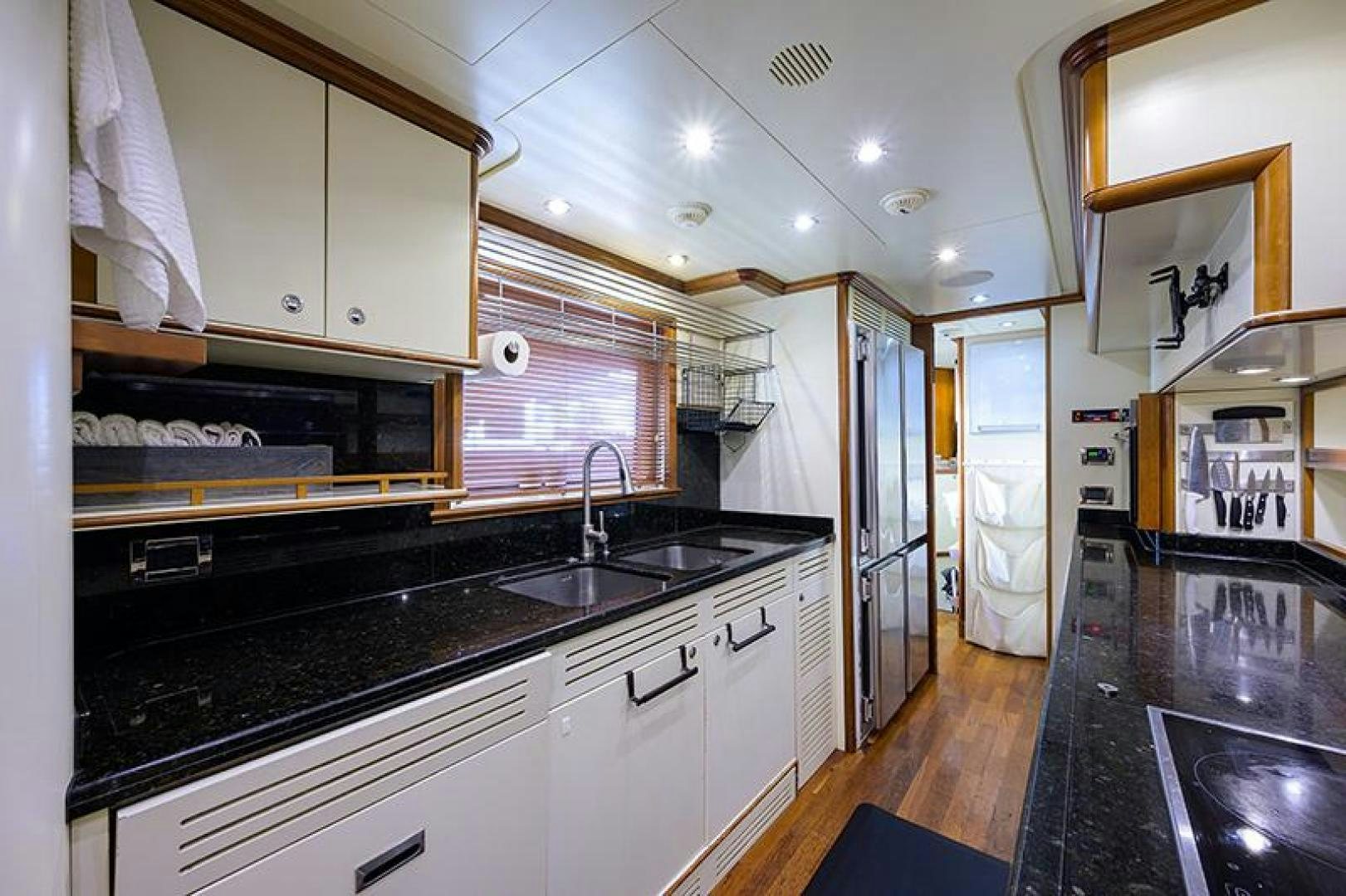a kitchen with a black counter top aboard BW Yacht for Sale