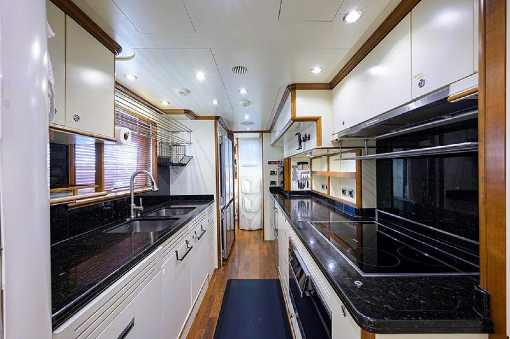 a kitchen with black counters aboard BW Yacht for Sale