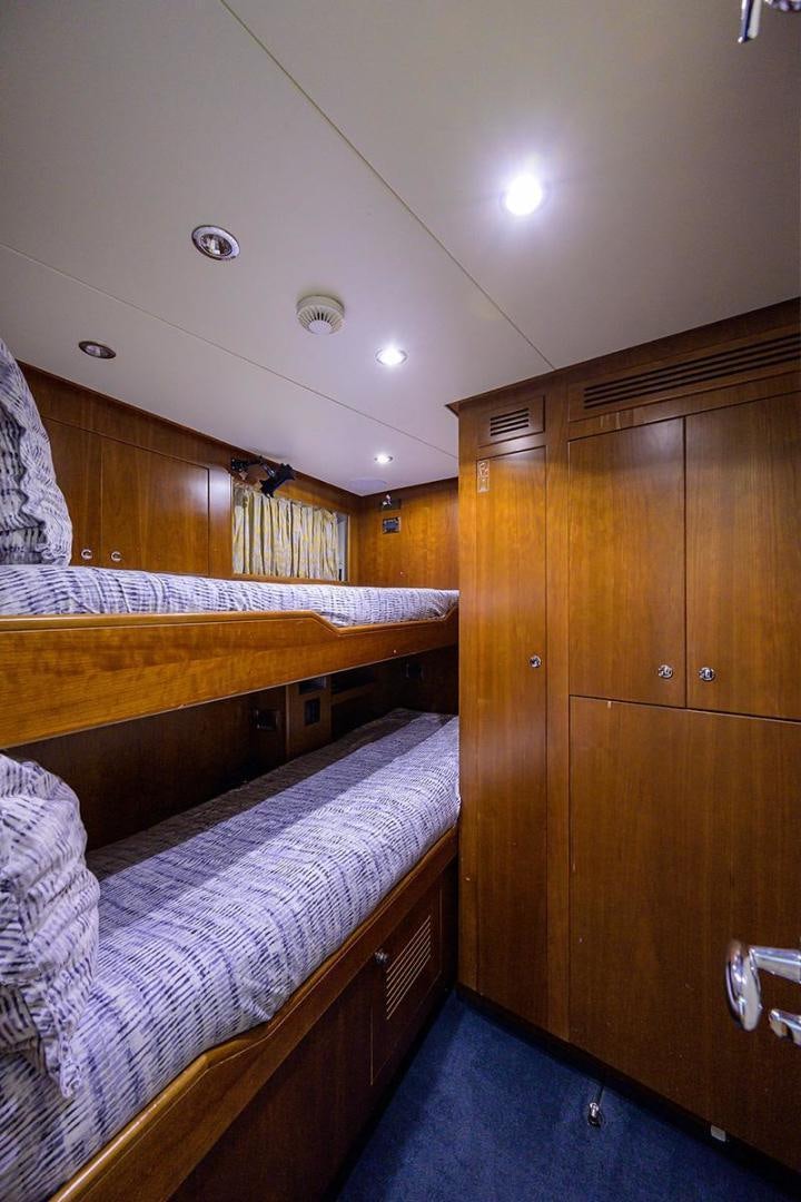 a room with wooden furniture aboard BW Yacht for Sale