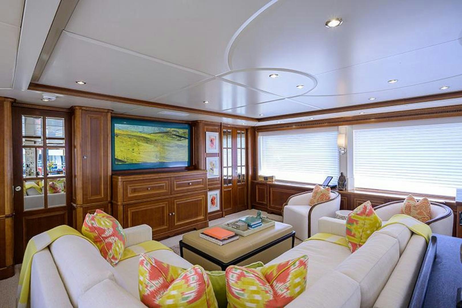 a living room with a tv and couches aboard BW Yacht for Sale
