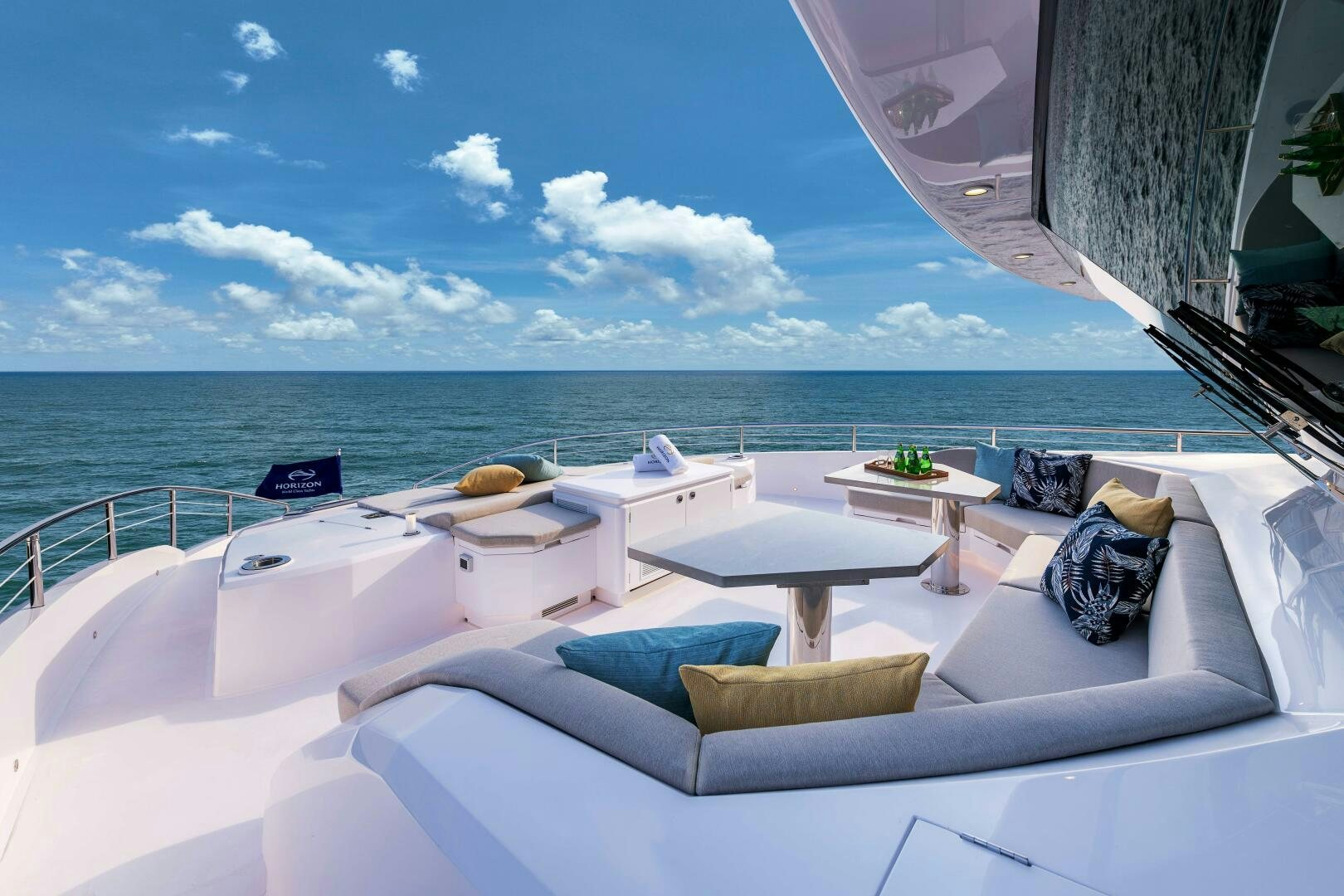 a room with a bed and a table on the deck aboard FD100 911 Yacht for Sale