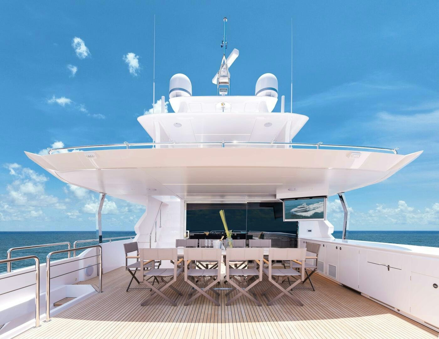 a large white ship with chairs around it aboard FD100 911 Yacht for Sale