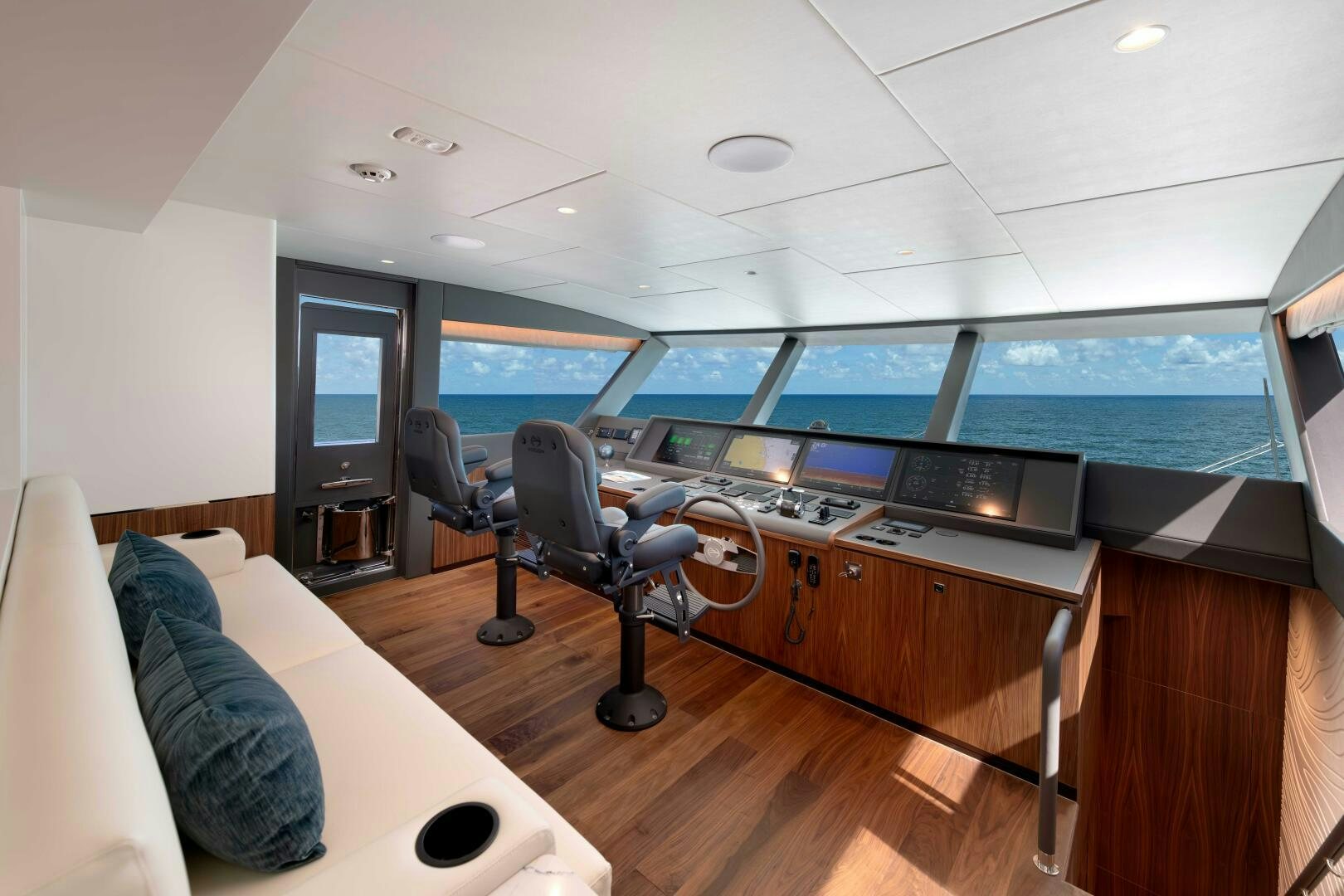 a room with a view of the ocean and the deck aboard FD100 911 Yacht for Sale