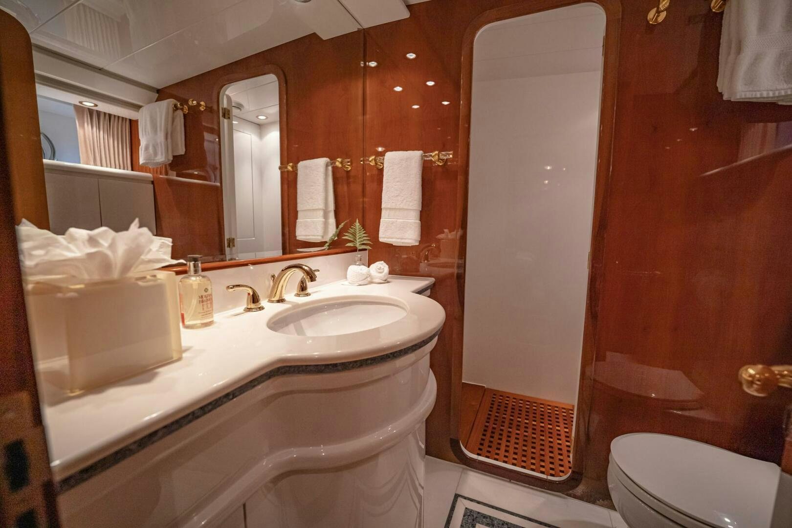 a bathroom with a sink and a toilet aboard SHALIMAR Yacht for Sale