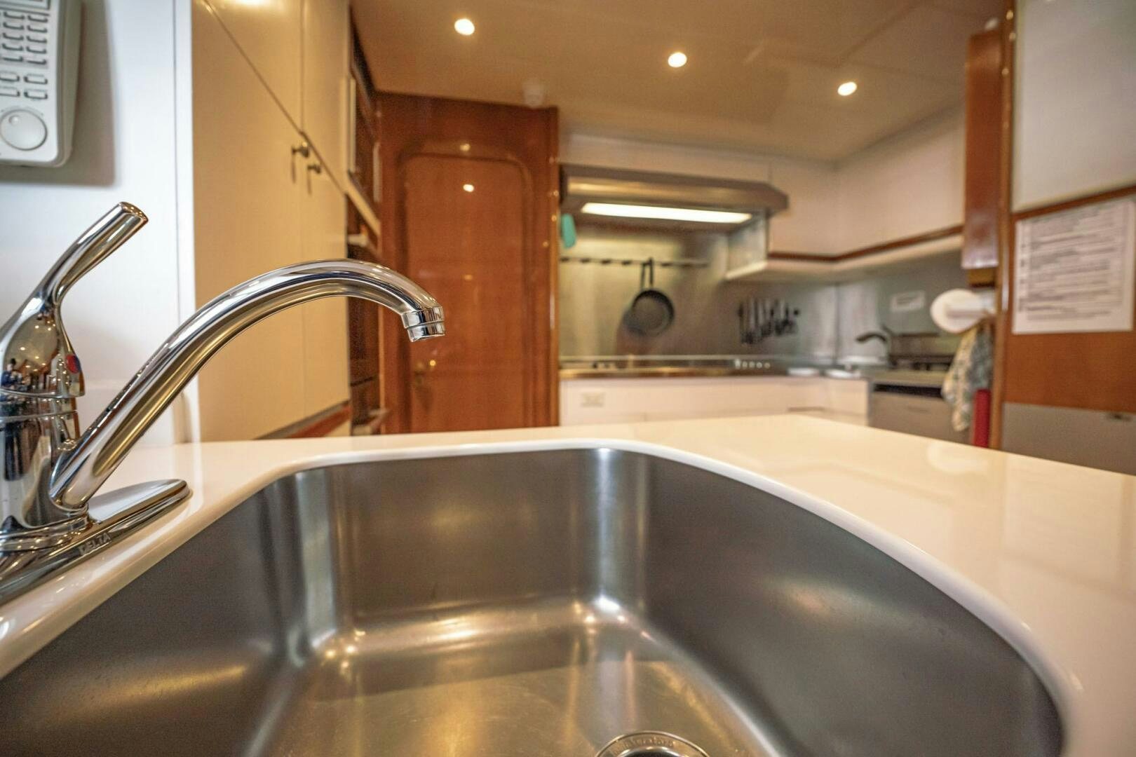 a kitchen with a stainless steel sink aboard SHALIMAR Yacht for Sale
