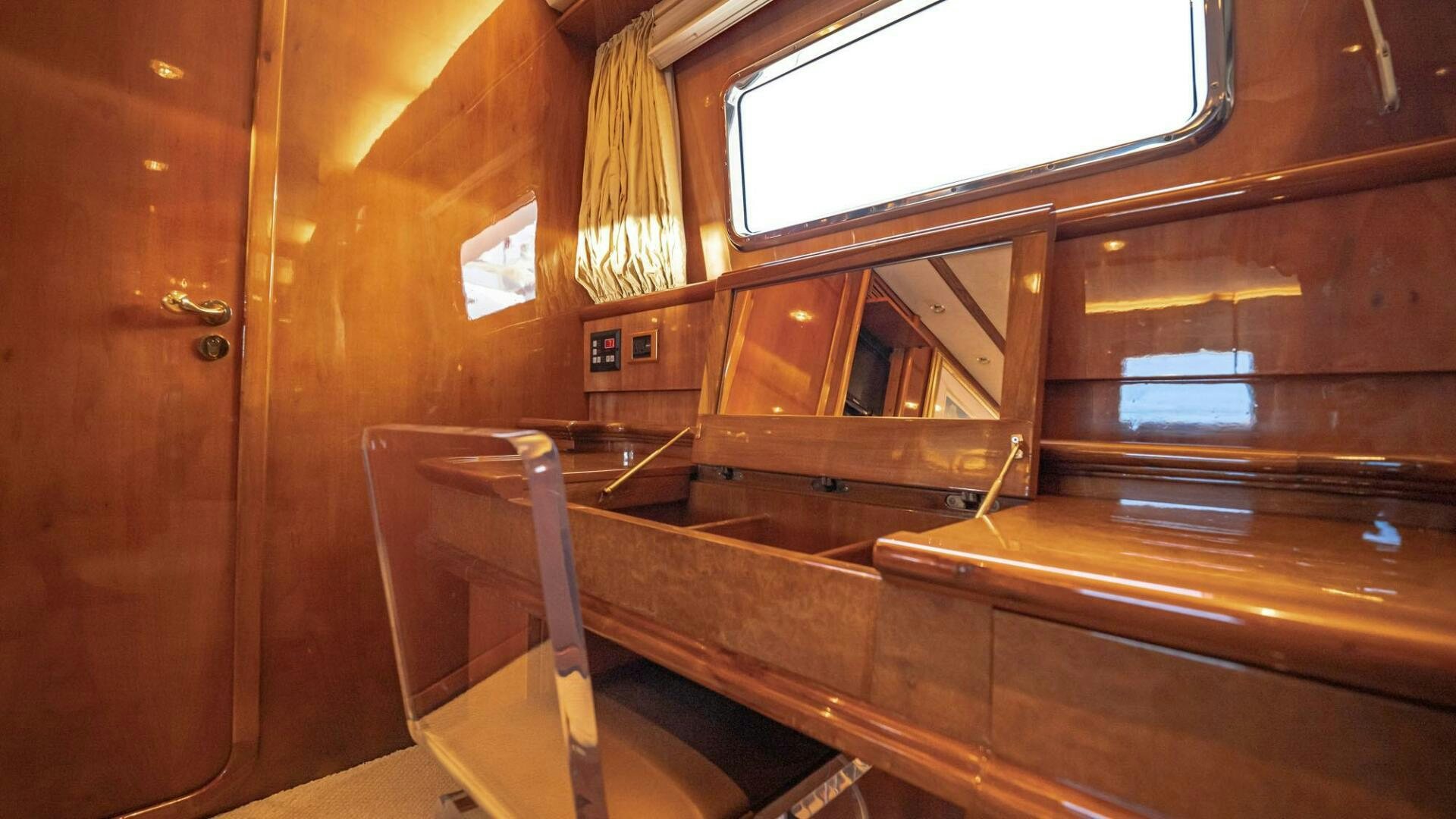 a wooden staircase with a glass window aboard SHALIMAR Yacht for Sale