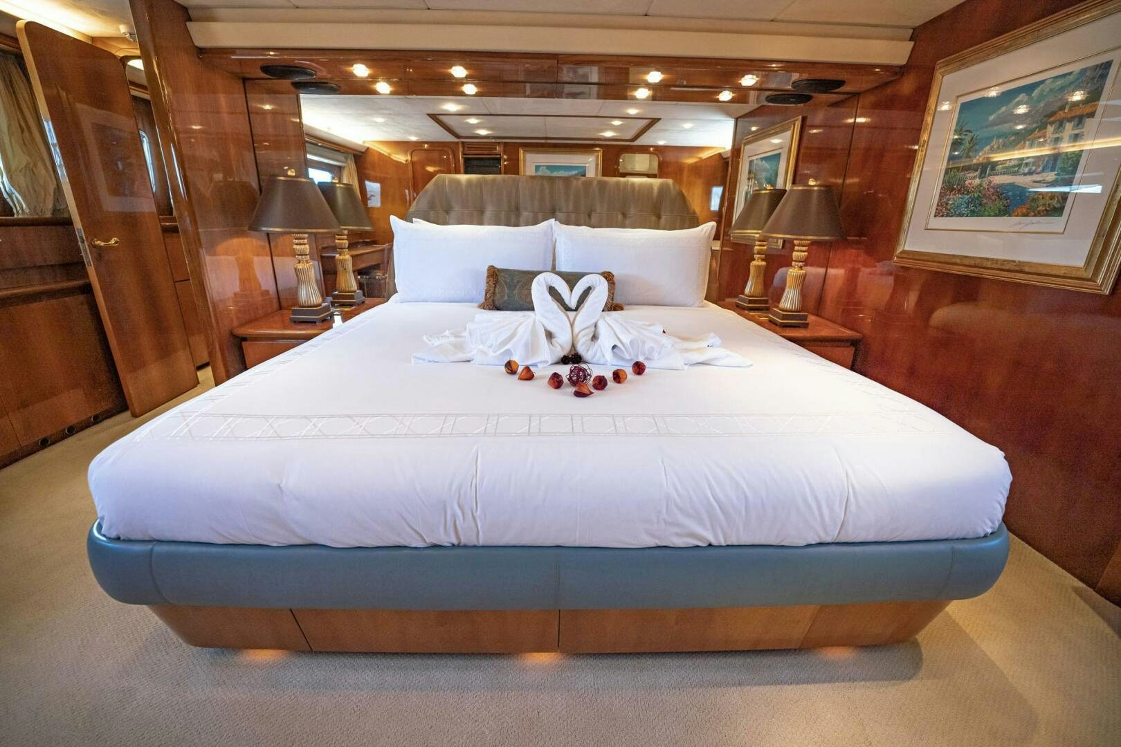 a bed with white sheets aboard SHALIMAR Yacht for Sale