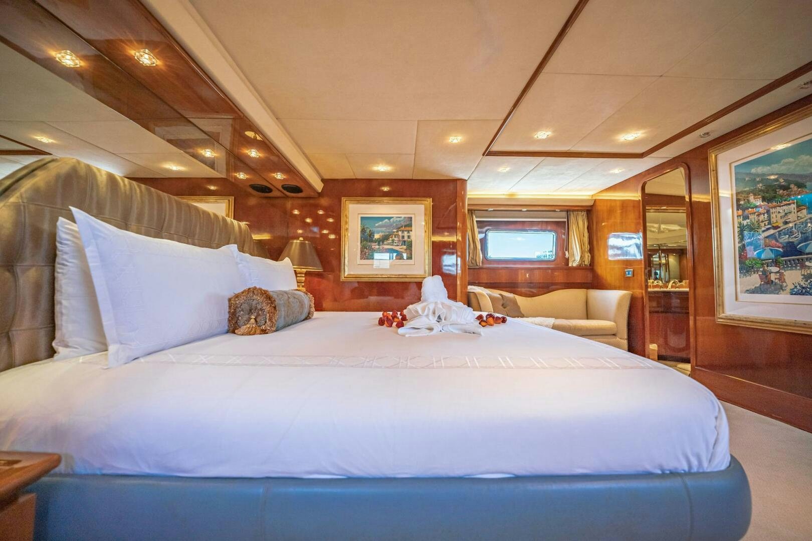 a bed with white sheets aboard SHALIMAR Yacht for Sale