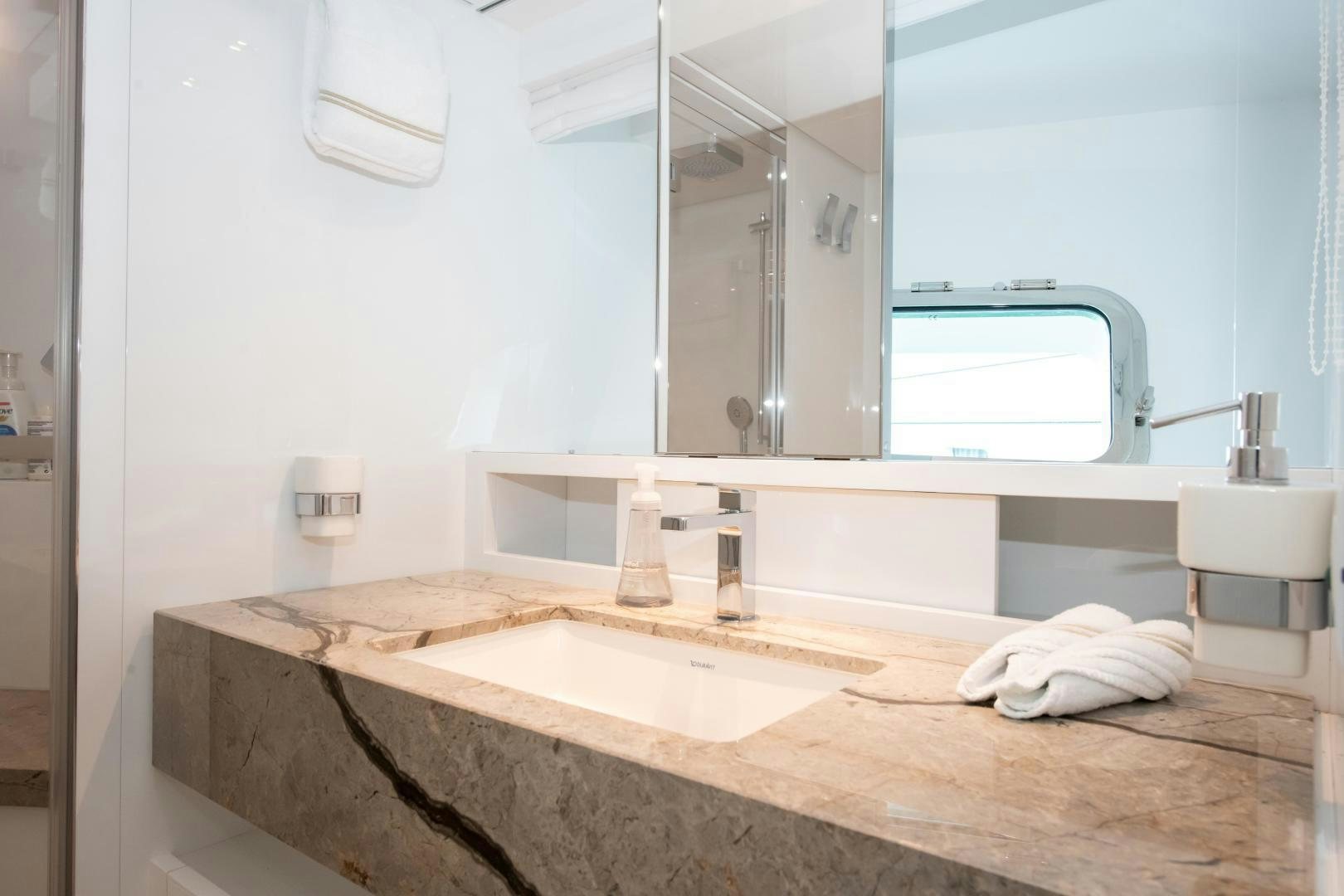 a bathroom with a large mirror aboard MARAVI Yacht for Sale