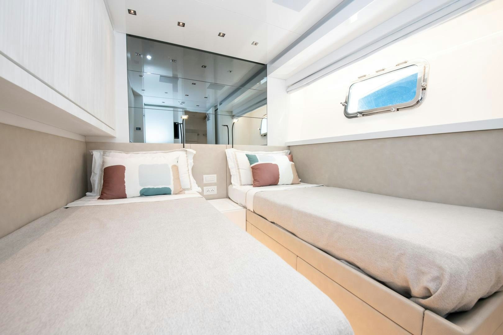 a room with beds and a television aboard MARAVI Yacht for Sale
