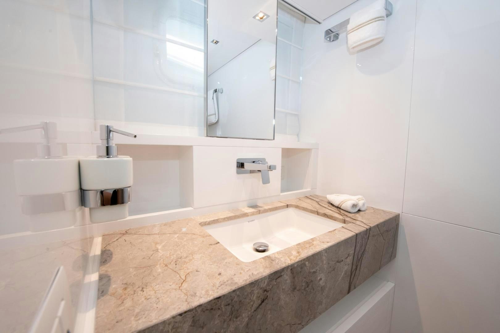 a bathroom with a sink and a mirror aboard MARAVI Yacht for Sale