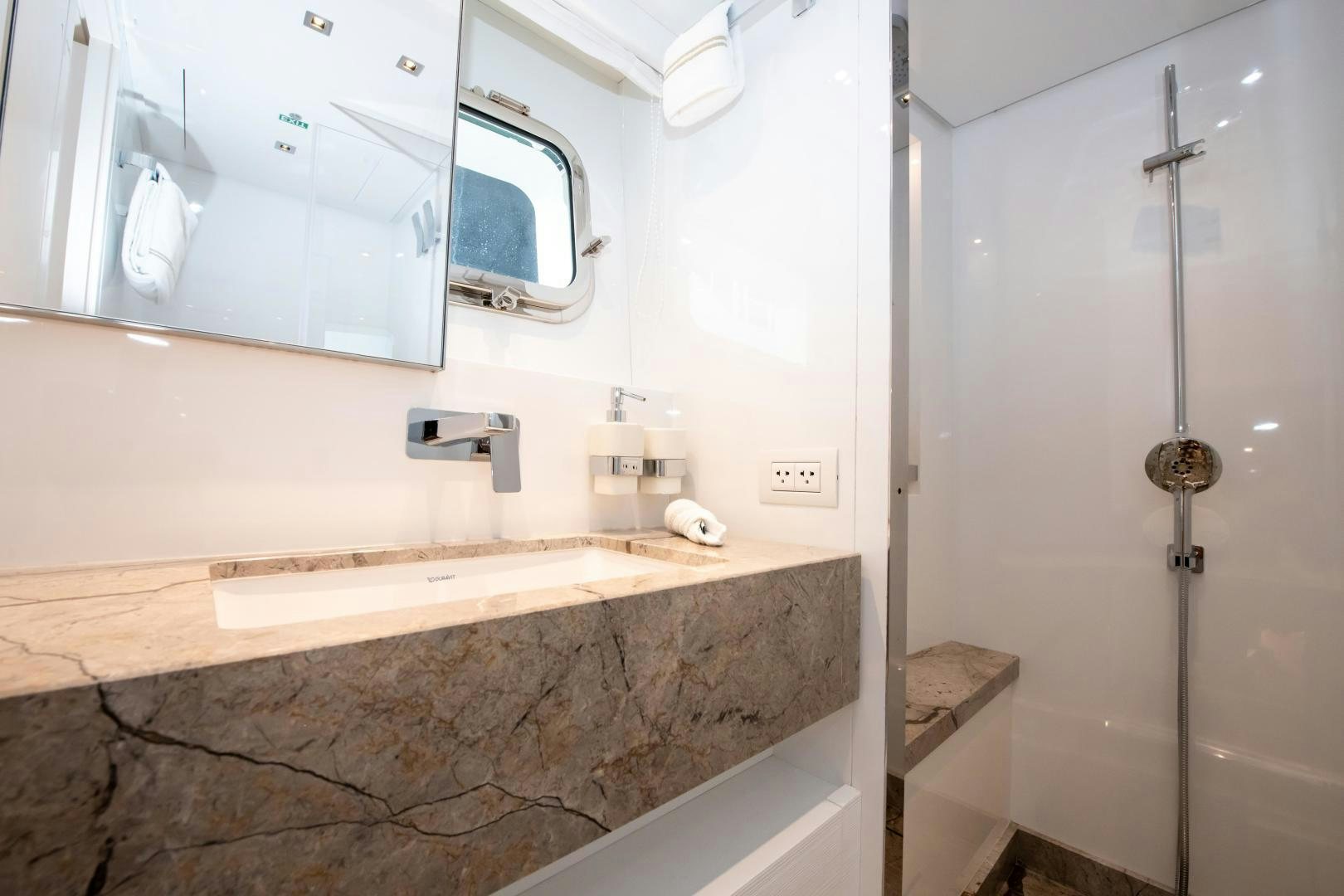 a bathroom with a marble countertop aboard MARAVI Yacht for Sale