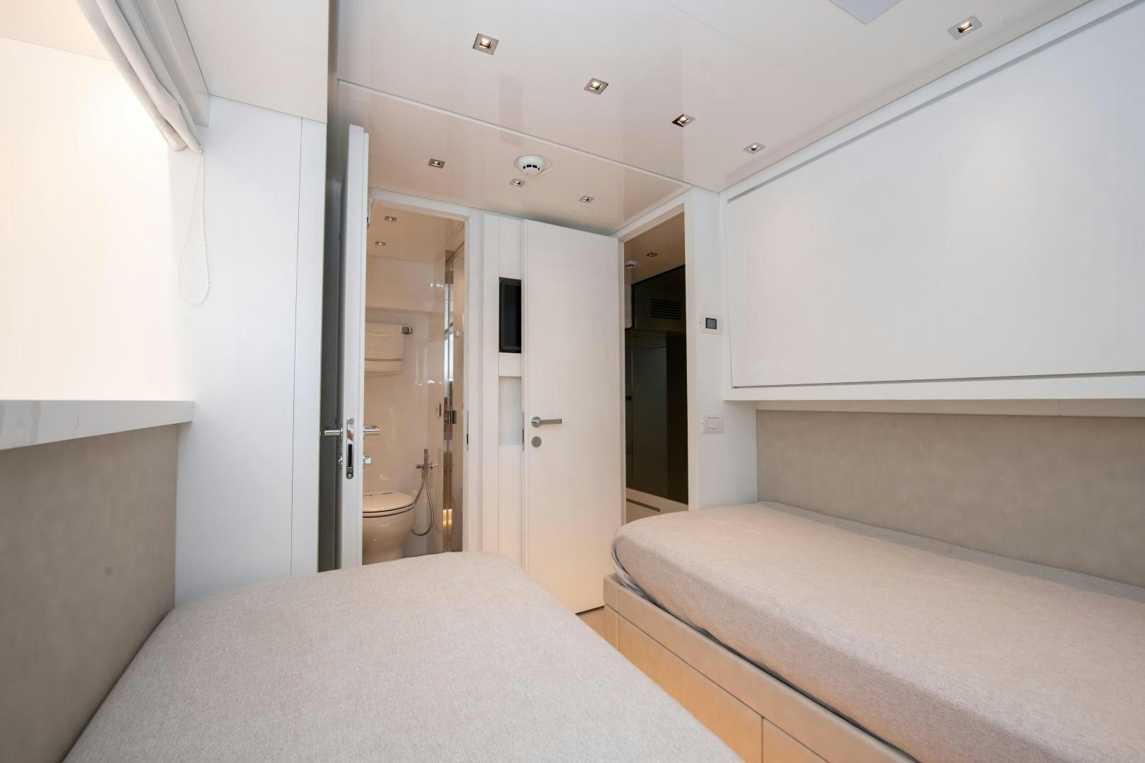 a room with a bed and a closet aboard MARAVI Yacht for Sale