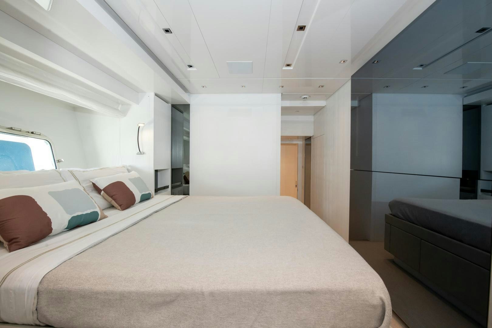 a room with a bed and a couch aboard MARAVI Yacht for Sale