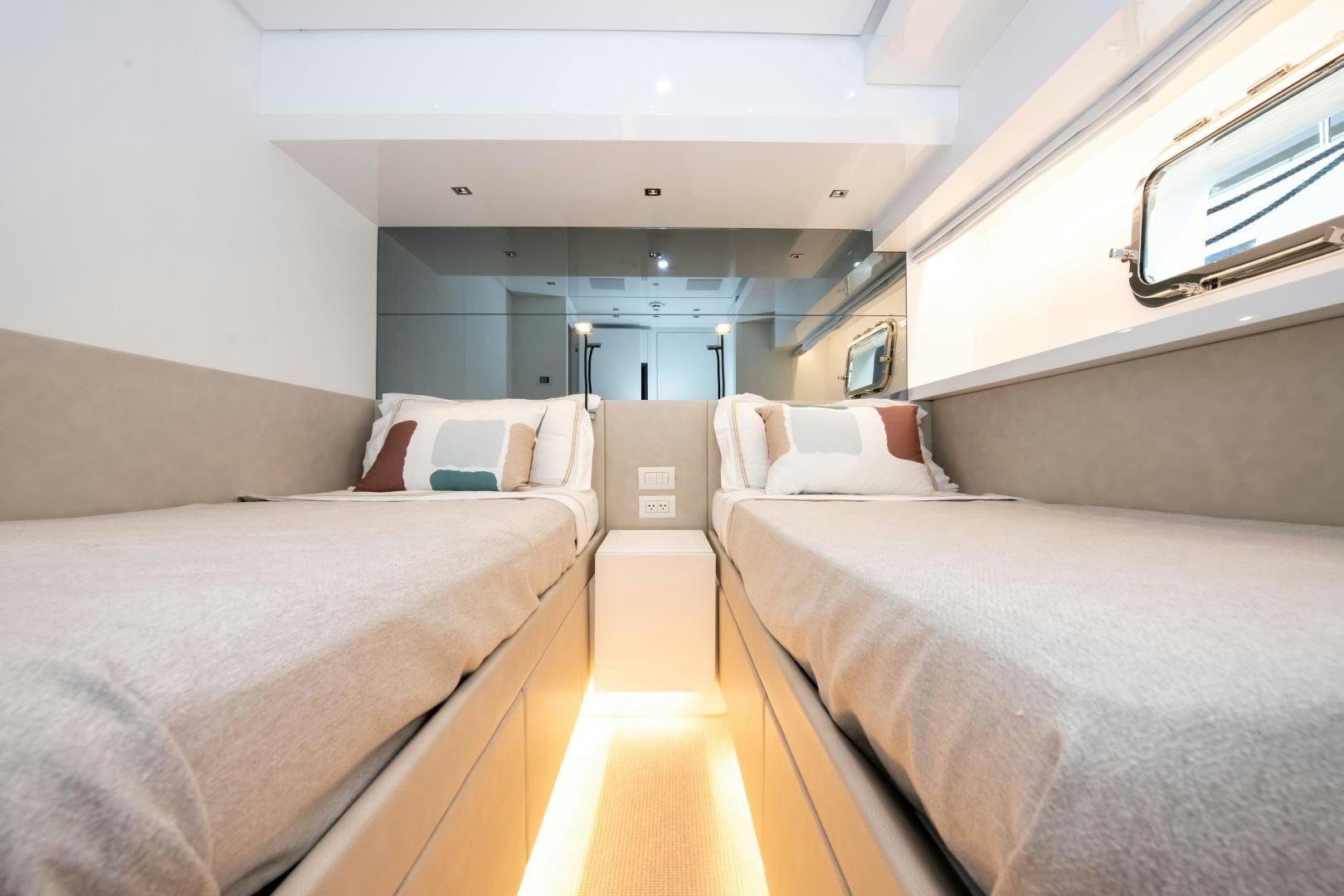 a room with beds and a window aboard MARAVI Yacht for Sale
